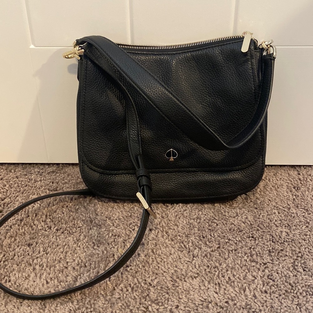Small black crossbody Kate Spade bag.